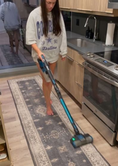 Clara Peirce doing her closing shift cleaning routine.