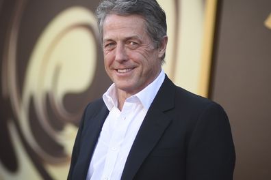 Hugh Grant arrives at the premiere of "Wonka" on Dec. 10, 2023, at Regency Village Theatre in Westwood, California