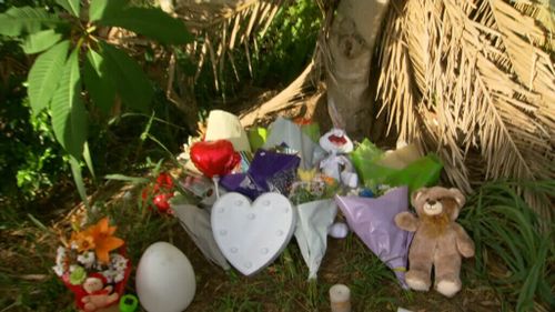 Locals and family friends placed flowers, teddy bears and balloons in memory of the young boy. (9NEWS)
