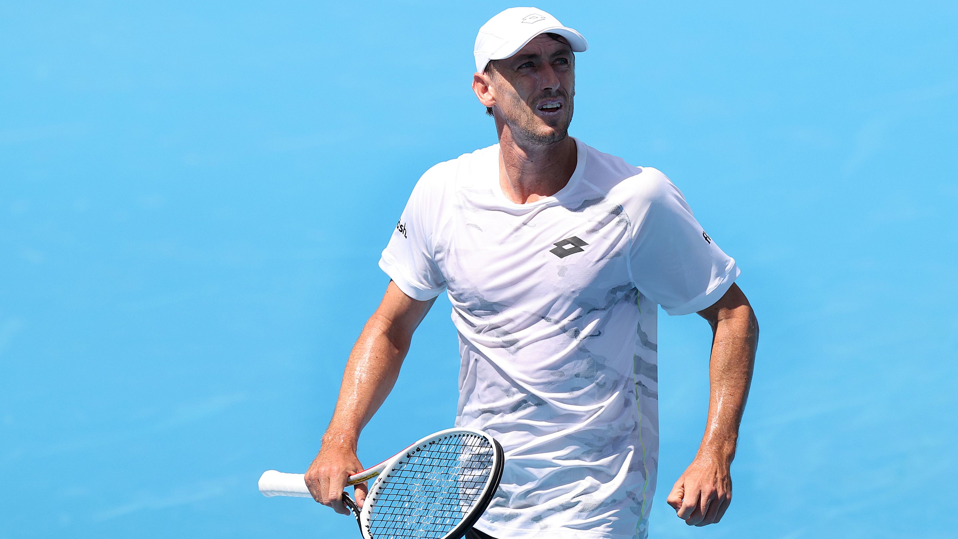 MELBOURNE, AUSTRALIA - JANUARY 10: John Millman of Australia looks on during a training session ahead of the 2024 Australian Open at Melbourne Park on January 10, 2024 in Melbourne, Australia. (Photo by Kelly Defina/Getty Images)