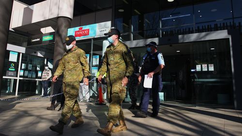 Australian Defence Force personnel and NSW police are seen being deployed from Bankstown Police Station in Sydney.