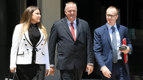 Rick Flori (centre), Renee Eaves (left) and lawyer Kris Jahnke leave the court. (Image: AAP)
