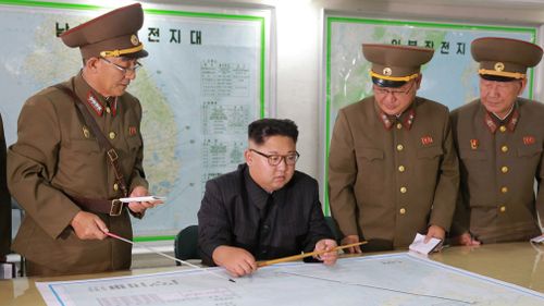 Kim Jong-un talks with North Korean military leaders. (AAP)