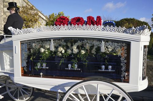 A horse-drawn carriage carrying the coffin of Liam Payne