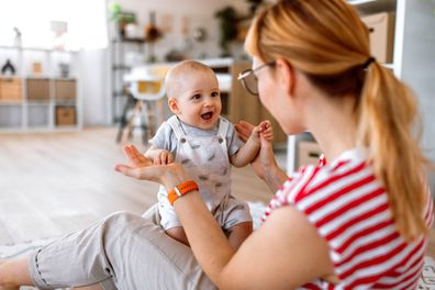 Mother and her baby son enjoying time at home together. 