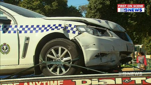 It is understood the police officers driving the car were unable to stop the vehicle before it collided with the property.