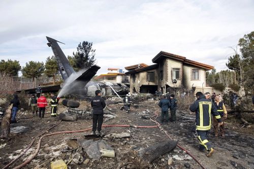 Fire crews worked to extinguish flames after a cargo plane crashed near Fath Airport in the city of Karaj, Iran.