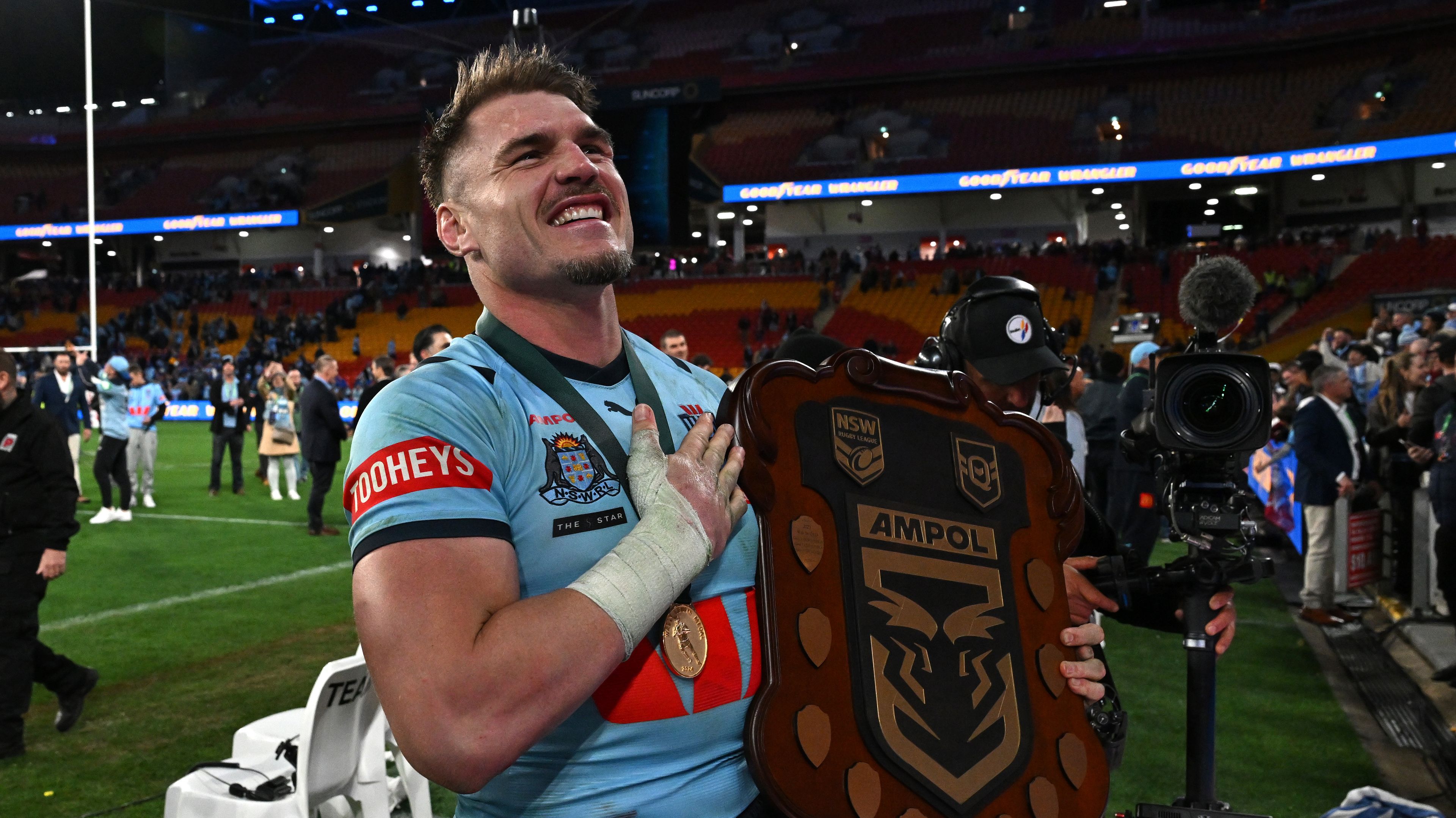 Angus Crichton poses with his Wally Lewis Medal and the State of Origin Shield.