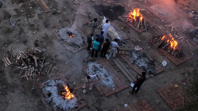 A view of a crematorium ground where mass cremation of victims who died due to the coronavirus disease is seen at a crematorium in New Delhi.