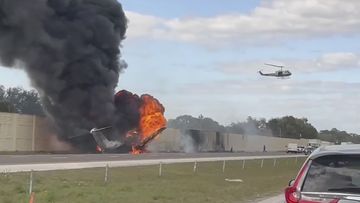 Smoke and fire fills the air after an airplane crashed on Interstate 75,  Friday, Feb. 10, 2024 near Naples, Fla.   