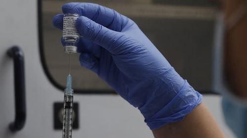 A vial of the Phase 3 Novavax coronavirus vaccine is seen ready for use in the trial