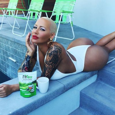 <p>Amber Rose "cleansing her body" with tea. By the pool. Just because.</p>