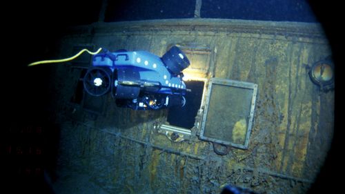 An underwater remote vehicle examines an open window of the Titanic 3.8 kilometres below the surface of the ocean, 640 kilometres off the coast of Newfoundland, Canada in 1986.