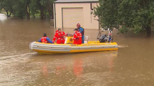 SES in floodwaters in Windsor, on the Hawkesbury River.