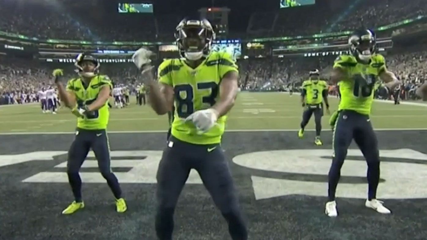 The Seattle Seahawks celebrate after a 60 yard touchdown by David Moore