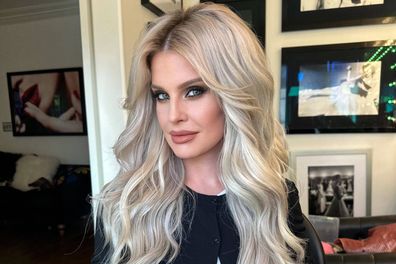 Kelly Osbourne poses with bright blonde hair after a transformation.