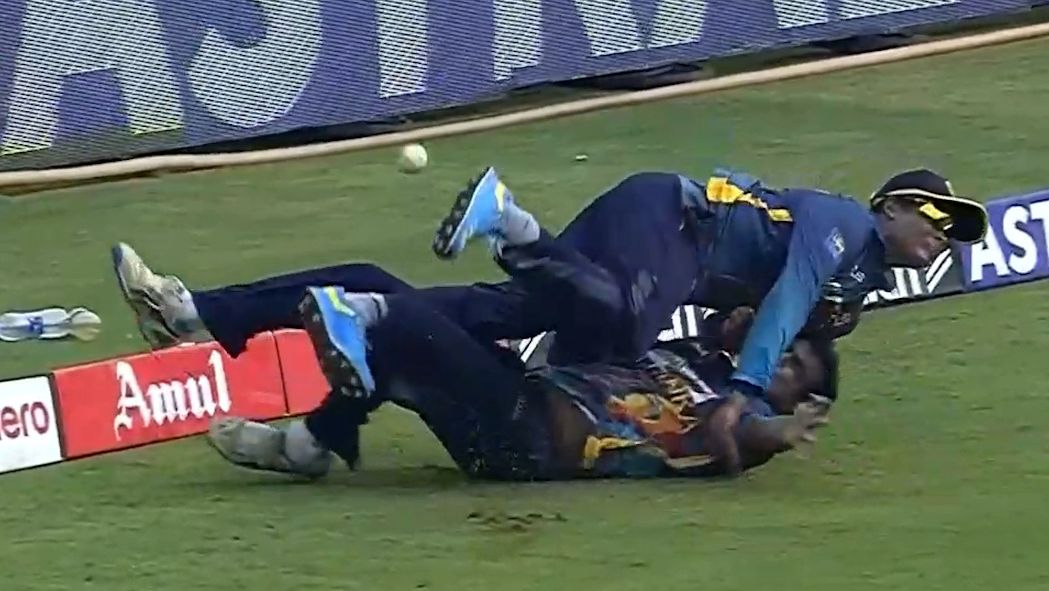 Ashen Bandara and Jeffrey Vandersay collide during the one day match between India and Sri Lanka.