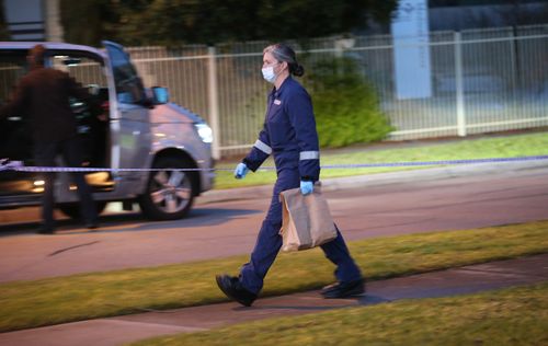 Forensic detectives bag evidence at the scene in Doveton. Picture: AAP