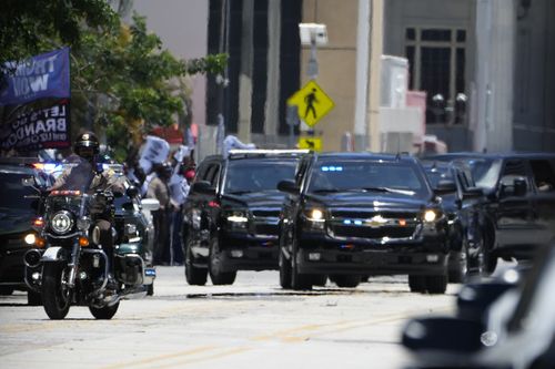 The motorcade carrying former President Donald Trump arrives near the Wilkie D. Ferguson Jr. US Courthouse, Tuesday, June 13, 2023, in Miami. 