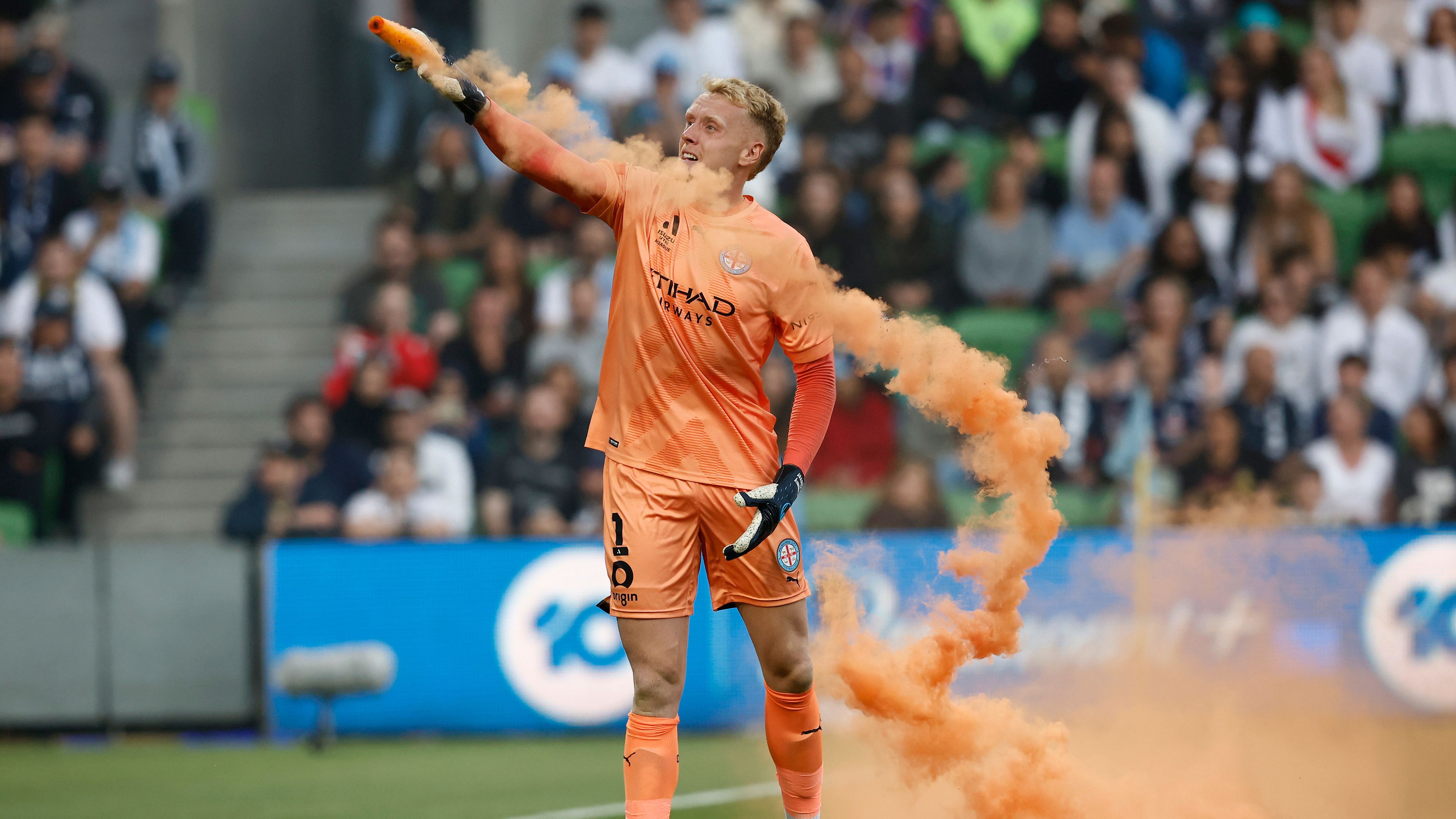 Tom Glover of Melbourne City picks up a flare to remove it from the pitch during the round eight A-League Men&#x27;s match between Melbourne City and Melbourne Victory at AAMI Park, on December 17, 2022, in Melbourne, Australia. (Photo by Darrian Traynor/Getty Images)