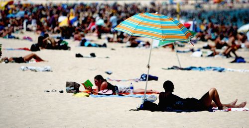 Tourists flock to a crowded Bondi beach