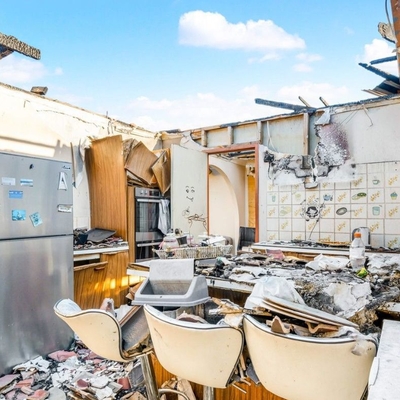 Sydney home with a collapsed roof over the kitchen sells for just under $1 million