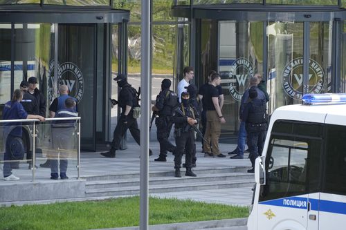 Policemen guard an area near an office of the 'PMC Wagner Centre', which is associated with the owner of the Wagner private military contractor, Yevgeny Prigozhin, in St. Petersburg, Russia, Saturday, June 24, 2023.  