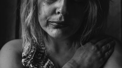 Stock photo of abused woman domestic violence victim.