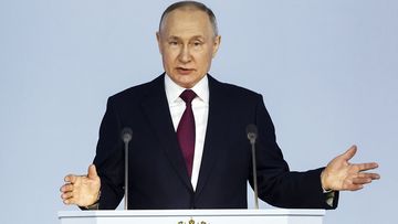 Russian President Vladimir Putin gestures as he gives his annual state of the nation address in Moscow, Russia, Tuesday, Feb. 21, 2023 