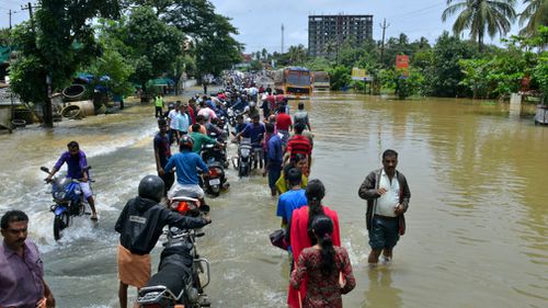 The state's top elected official, Pinarayi Vijayan, told reporters that at least 324 people had died and more than 220,000 had taken refuge in the camps.