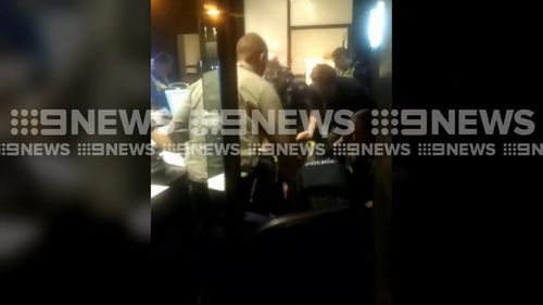 The man allegedly responsible for the flooding barricaded himself in an office before he was arrested. Picture: 9NEWS.