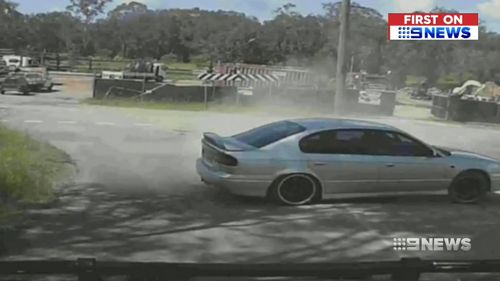 The hoon driver managed to veer off and pull to a stop just metres from Luke Taylor's oncoming car. (9NEWS)