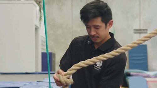 Coach Wei Jun Lee runs a Gold Coast gymnastics studio.