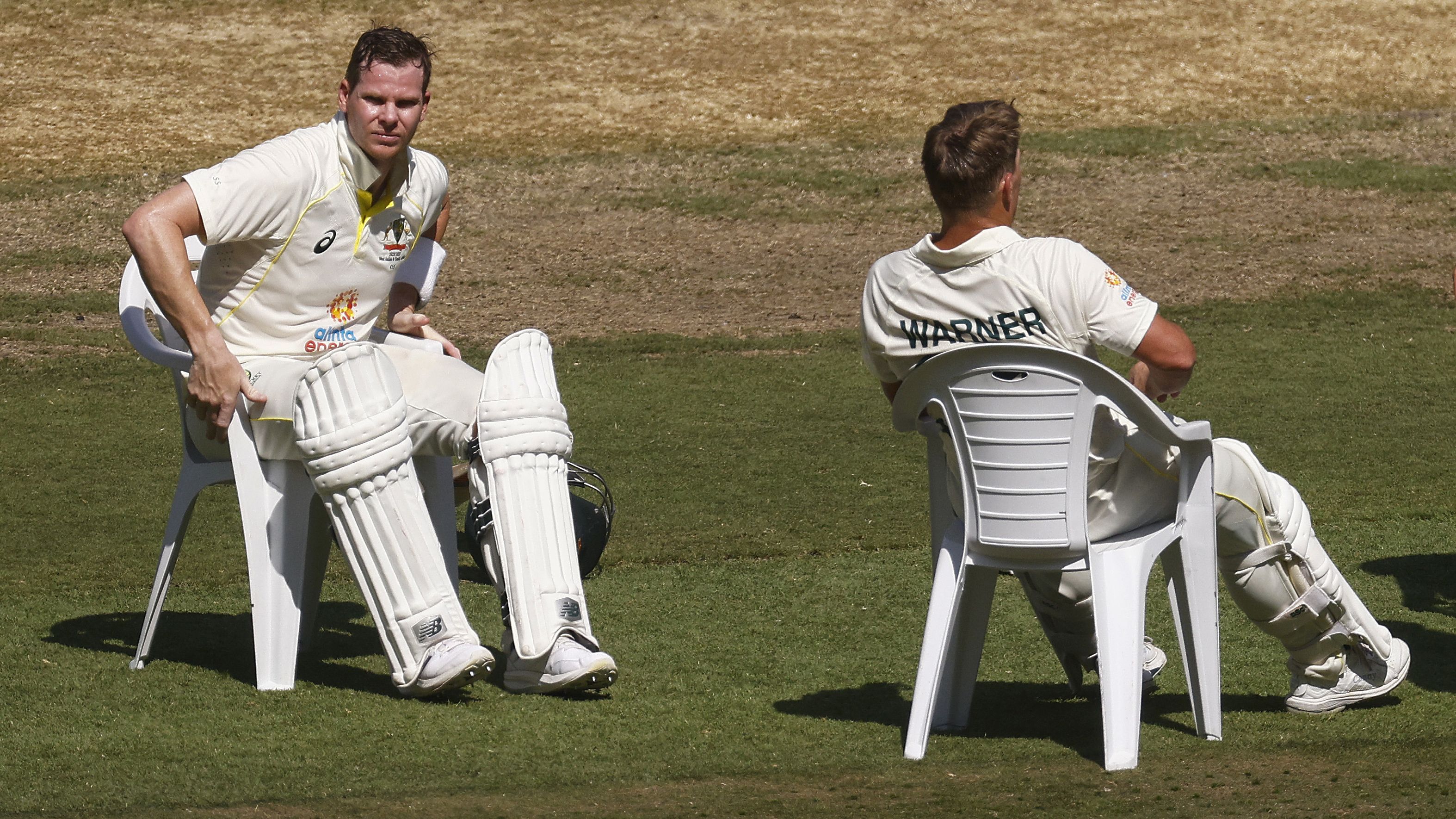 MELBOURNE, AUSTRALIA - DECEMBER 27: Steve Smith of Australia (L) and David Warner of Australia take a seat on the afternoon drinks break during day two of the Second Test match in the series between Australia and South Africa at Melbourne Cricket Ground on December 27, 2022 in Melbourne, Australia. (Photo by Daniel Pockett - CA/Cricket Australia via Getty Images)