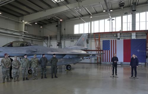 NATO Secretary General Jens Stoltenberg, second right, and Polish President Andrzej Duda address the media at Lask air base in Poland, Tuesday, March 1, 2022. 