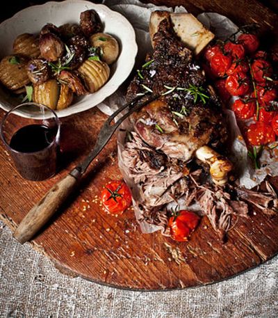 Slow-roasted greek lamb with tomatoes, onions and hasselback potatoes