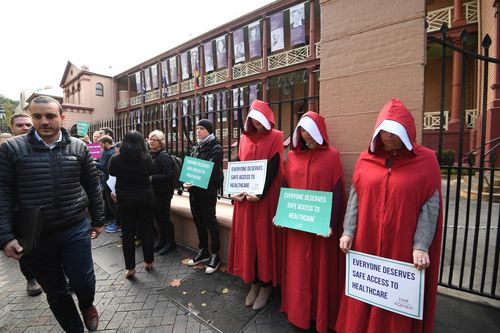 Supporters of the bill dressed as characters from the Handmaid's Tale. Picture: AAP