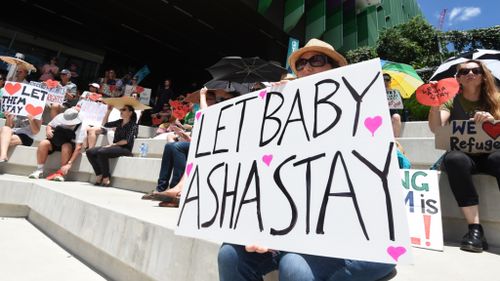 Protesters rally in support of Lady Cilento Children's Hospital not to discharge Baby Asha. (AAP)