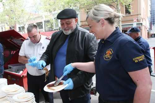 Mick Gatto (centre) is seen with Rachel Cowling from the United Firefighters association and Major Brendan Nottle from the Salvation Army at a fundraising launch in Melbourne, Thursday, October 10, 2019. The Salvation Army is calling for more accomodation for the homeless. (AAP Image/David Crosling) NO ARCHIVING