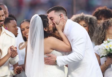 A couple marries during the Bad Bunny performance at the Super Bowl LX Halftime Show at Levi's Stadium on February 8, 2026 in Santa Clara, California. 