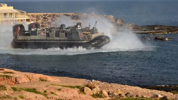 A US amphibious hovercraft departs with evacuees from Janzur, west of Tripoli, Libya.