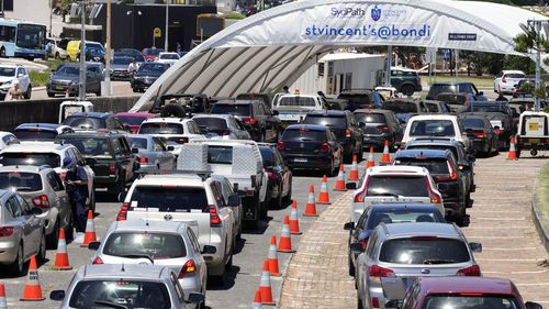 Cars line up at a drive-through COVID-19 testing clinic at Bondi Beach in Sydney.