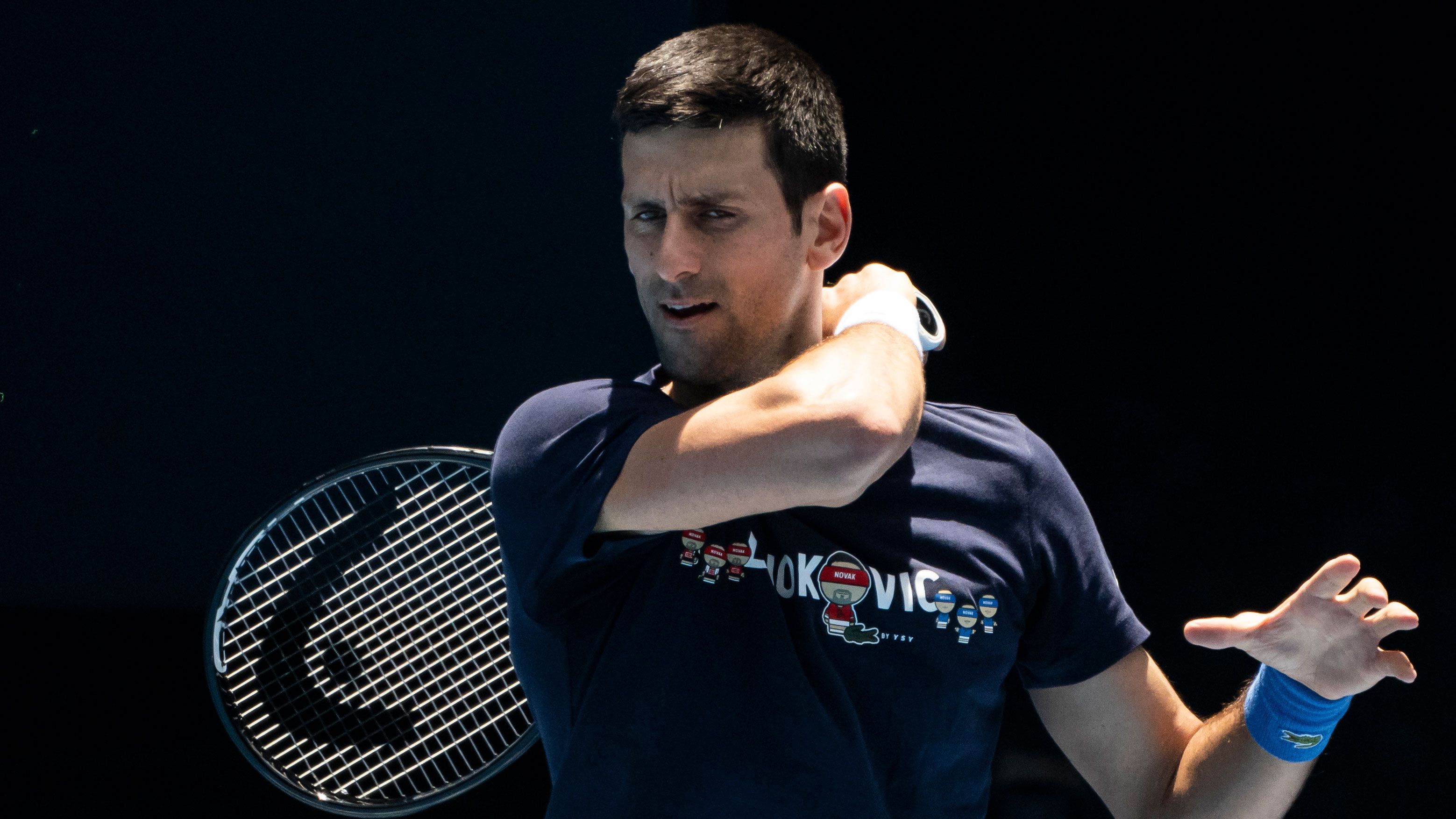 Novak Djokovic hits a forehand during a practice session ahead of the 2022 Australian Open at Melbourne Park.