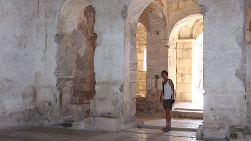 A tourist visits the St Nicholas church. (Getty)