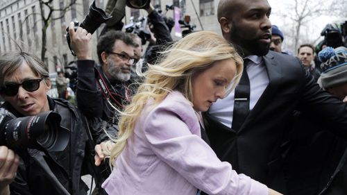 orn actress Stormy Daniels was swarmed by photographers and nearly fell as she was hustled into a federal courthouse. (AP)