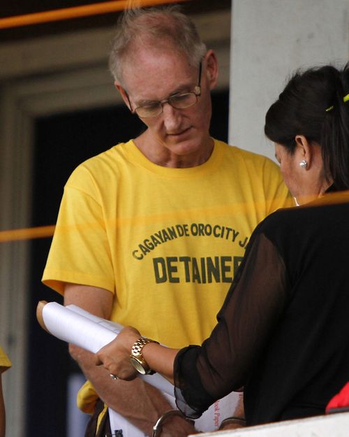 Gerard Peter Scully of Australia (L), an alleged kingpin of a child porn cyber den in the Philippines. Source: AFP