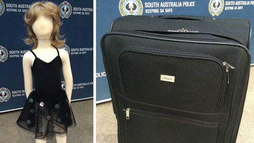 A black dress and suitcase similar to those found by the Karoonda Highway on July 15. (SA Police)