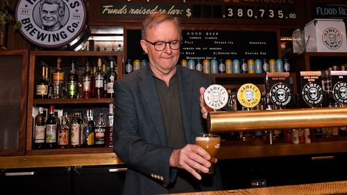 Prime Minister Anthony Albanese pours a beer during a visit to the Bob Hawke Beer & Leisure Centre in Marrickville