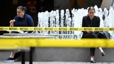 Taped off tables and chairs are seen in a closed cafe after a nationwide shutdown of cafes, restaurants and licensed venues, in Sydney, Tuesday, March 24, 2020. 