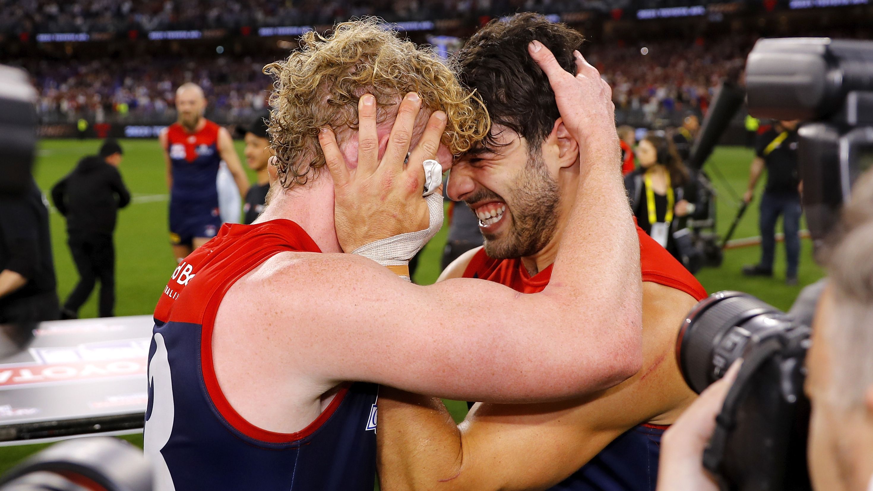 Clayton Oliver and Christian Petracca celebrate after the 2021 Grand Final.